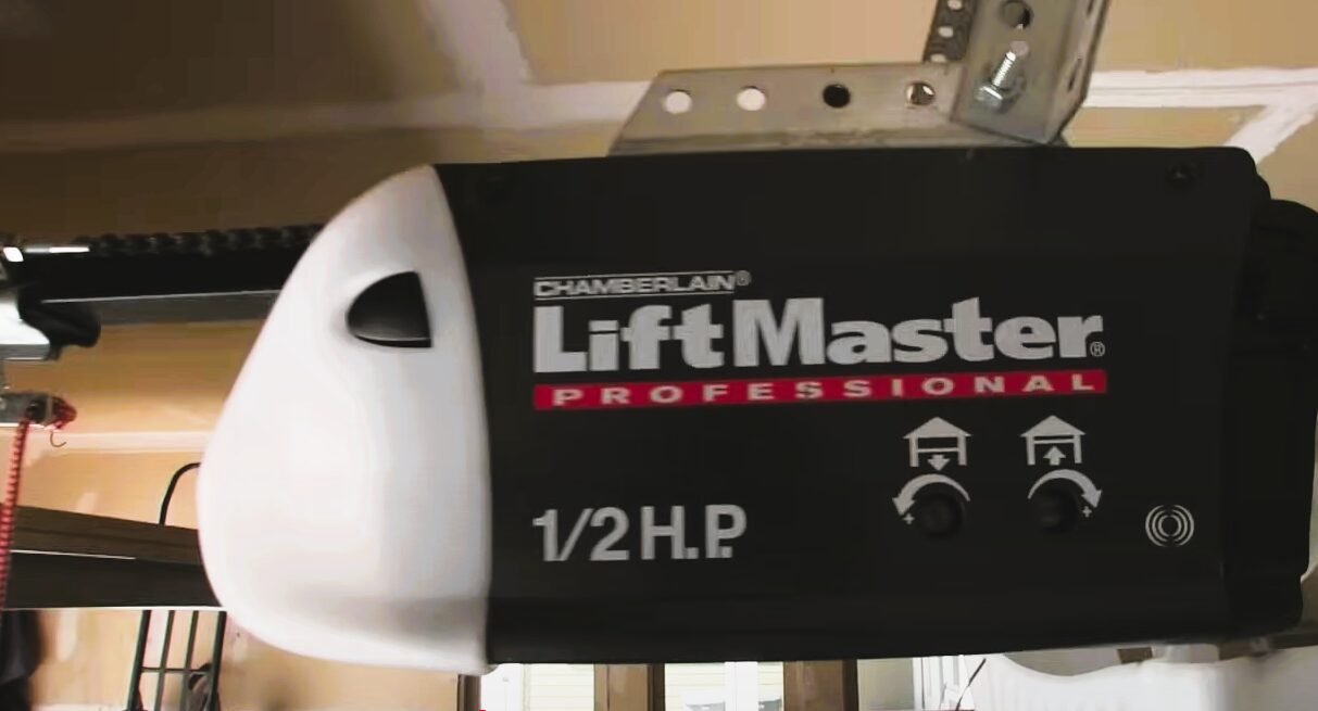 Garage door opener replacement service in action by Local Garage Door Repair Company, featuring skilled technician installing a new motor unit in a residential garage