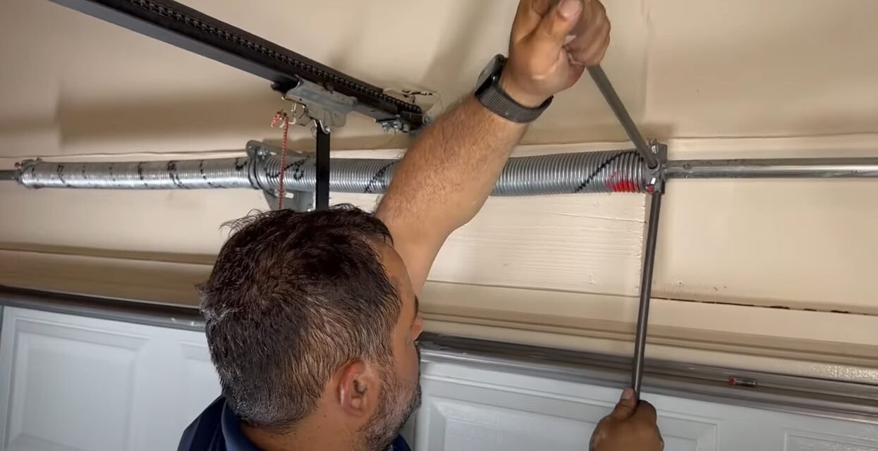 Close-up image of a technician replacing a garage door spring, showcasing professional repair service offered by Local Garage Door Repair Company.